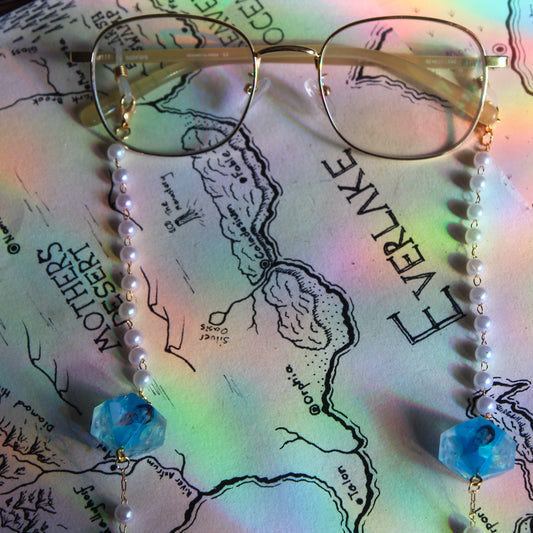 Pedro Pascal in Blue Glasses Chain with Dice