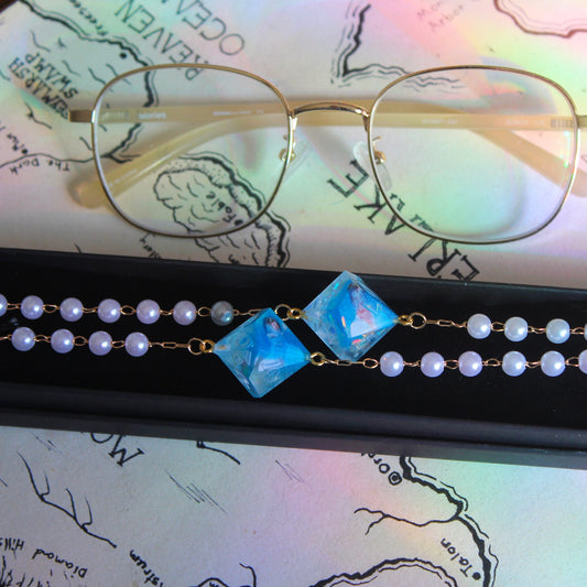 Pedro Pascal in Blue Glasses Chain with Dice