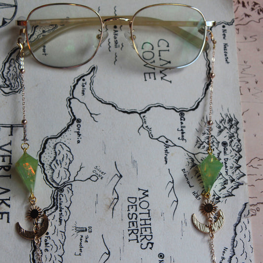 Green Planet with a Sun and Moon Glasses Chain with Dice