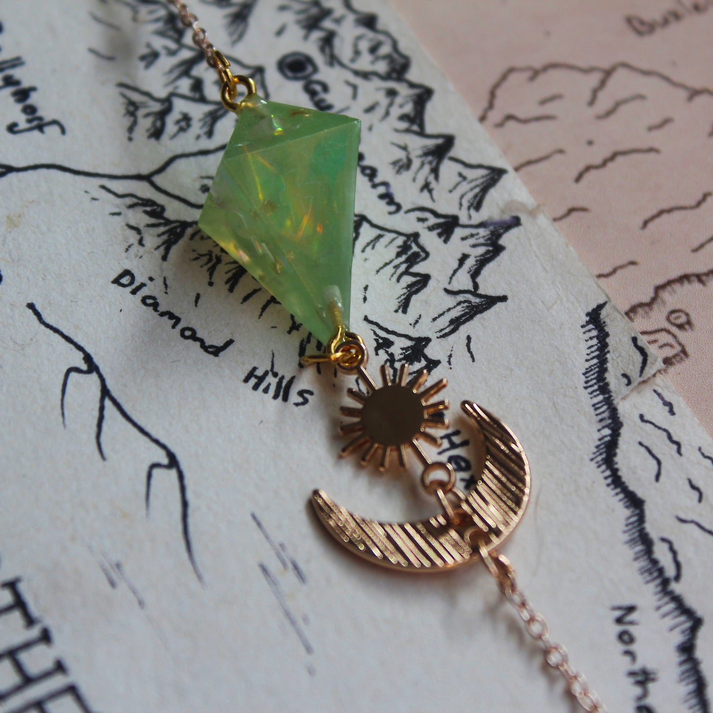 Green Planet with a Sun and Moon Glasses Chain with Dice