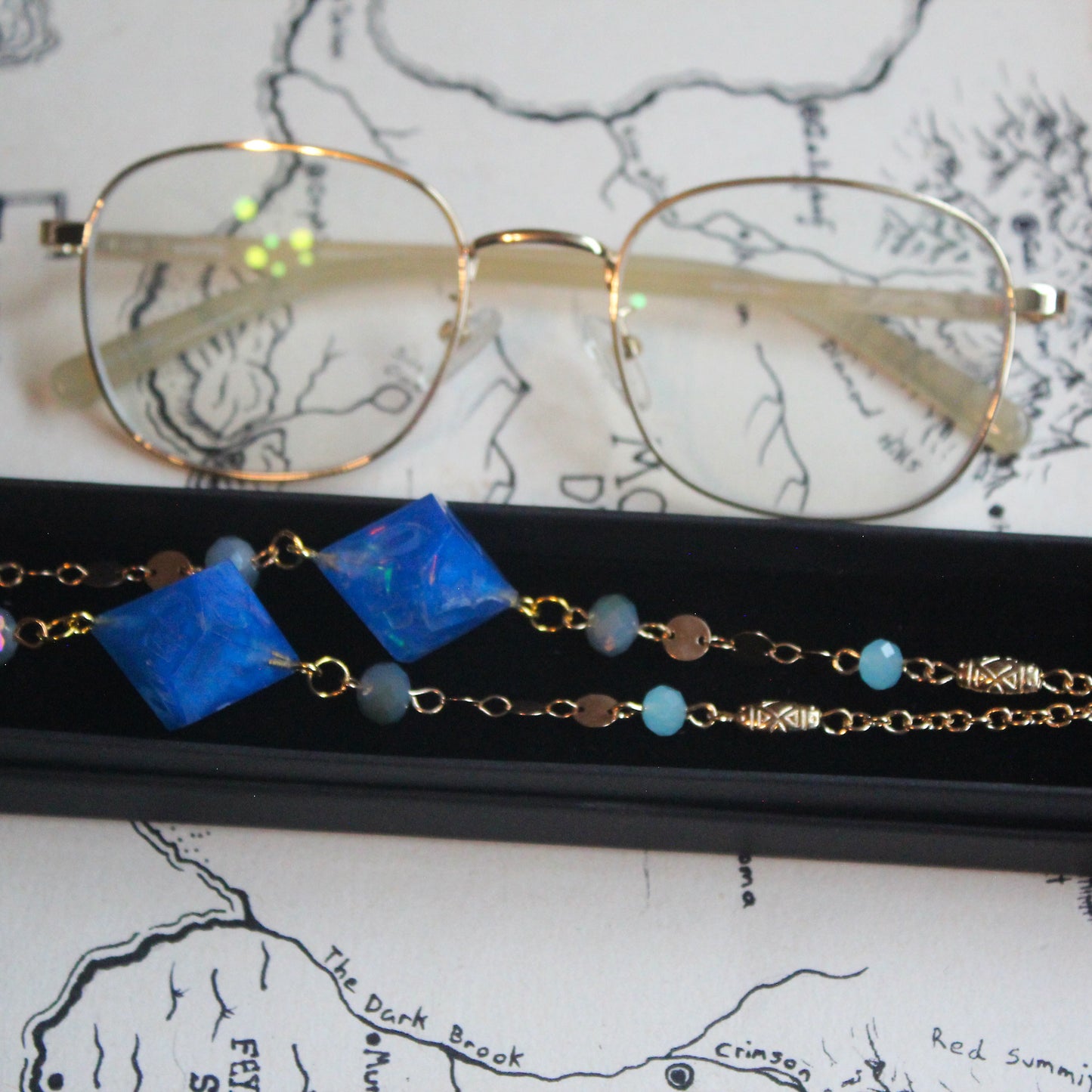 Neptune & Moons Glasses Chain with Dice