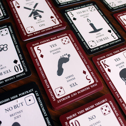 Collection of tarot cards with various symbols and text on a wooden surface